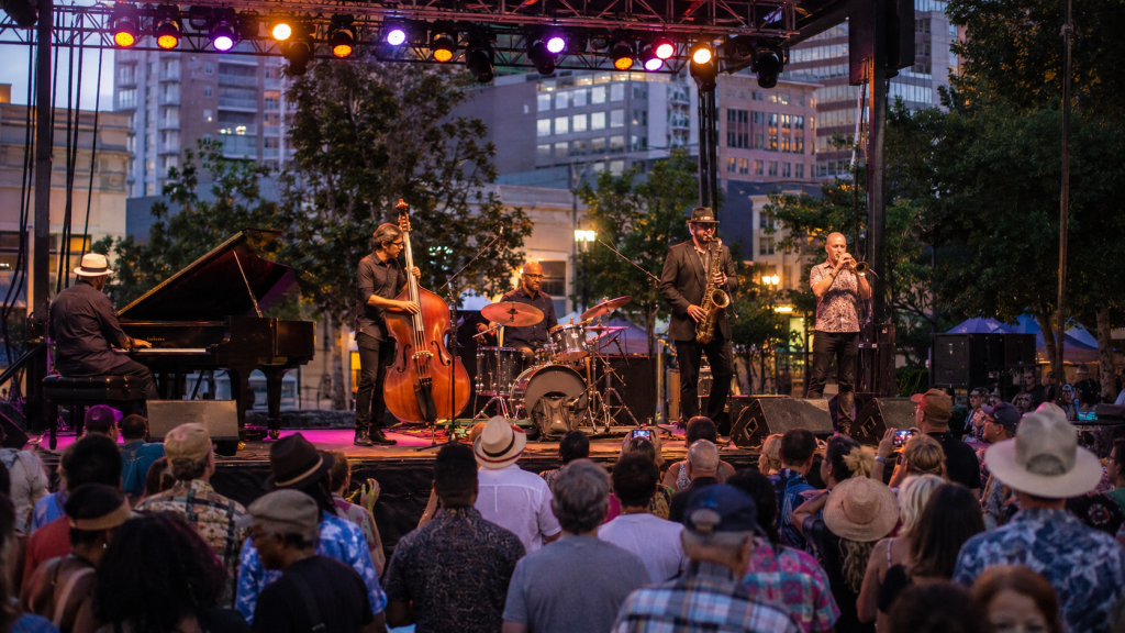 Jazz band performing on an outdoor stage during a summer festival in San Jose